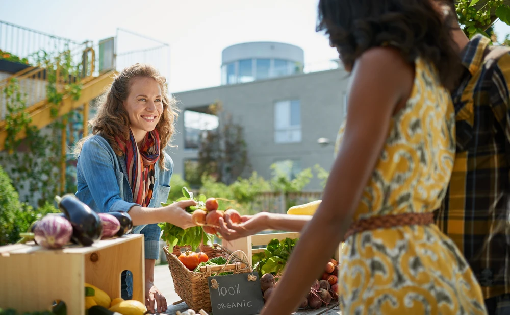 Couple purchasing produce from the farmers market