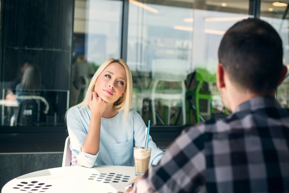 Young couple on a first date at a cafe