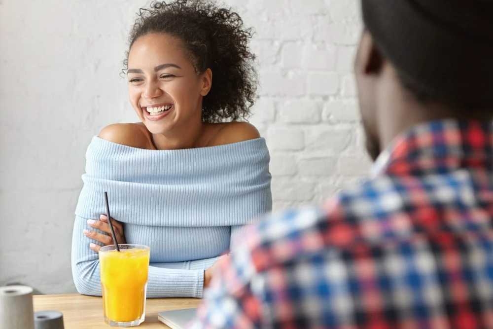 Young couple sitting down for a first date